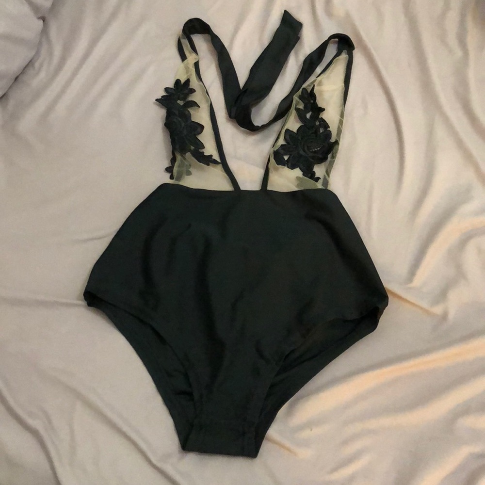 One piece swimsuit. NEVER WORN!